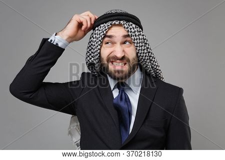 Puzzled Young Bearded Arabian Muslim Businessman In Keffiyeh Kafiya Ring Igal Agal Classic Black Sui