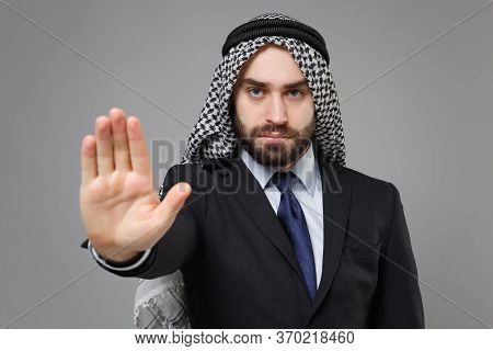 Serious Bearded Arabian Muslim Businessman In Keffiyeh Kafiya Ring Igal Agal Classic Black Suit Isol