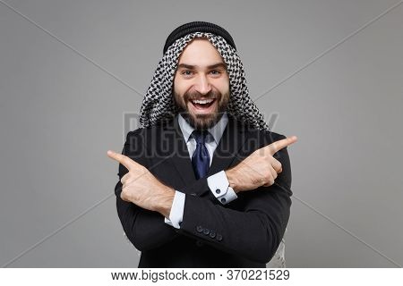 Funny Arabian Muslim Businessman In Keffiyeh Kafiya Ring Igal Agal Classic Suit Isolated On Gray Bac