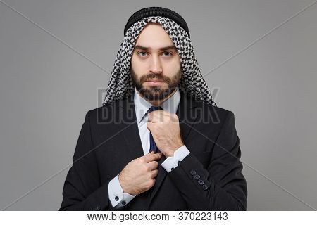 Young Bearded Arabian Muslim Businessman In Keffiyeh Kafiya Ring Igal Agal Classic Black Suit Shirt 