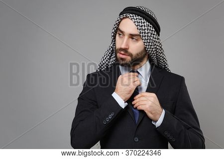 Young Bearded Arabian Muslim Businessman In Keffiyeh Kafiya Ring Igal Agal Classic Black Suit Shirt 