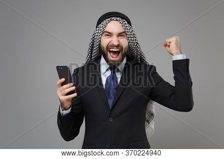 Happy Arabian Muslim Businessman In Keffiyeh Kafiya Ring Igal Agal Classic Black Suit Isolated On Gr