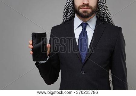 Cropped Image Of Arabian Muslim Businessman In Keffiyeh Kafiya Ring Igal Agal Suit Isolated On Gray 