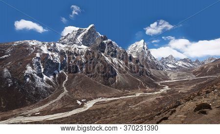 Himalayan Mountain Landscape With Panoramic View Of Cholatse And Taboche Mountains On The Road To Ev