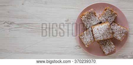 Homemade Tasty Applesauce Cake On A Pink Plate On A White Wooden Background, Top View. Flat Lay, Ove