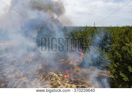Aerial Drone View Of A Wildfire In Forested Area.