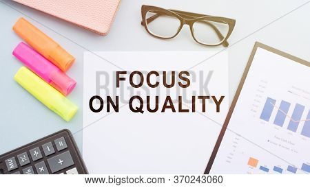 Focus On Quality Words On Notebook. Product Or Service Quality Concept In Business.
