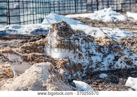 Spring Is On The Street. Dirty Snow. Snow Melts. Spring Weather. Close Up Of Dirty Snow.