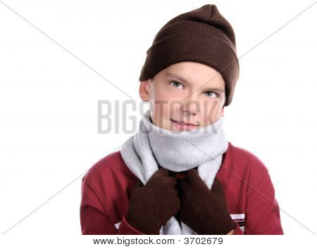 Smiling Pre-Teen Child Bundled In Winter Clothing