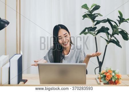 Beautiful Young Asian Woman Using Video Conference Call To People,work From Home,work At Home