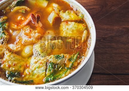 Acacia Omelets And Fresh Shrimp In Vegetable Sour Soup At Restaurant. Deep Fried Cha Om Leaves With 