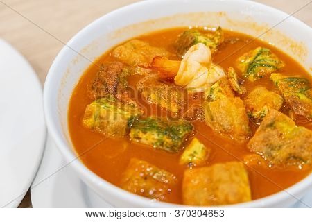 Acacia Omelets And Fresh Shrimp In Vegetable Sour Soup At Restaurant. Deep Fried Cha Om Leaves With 