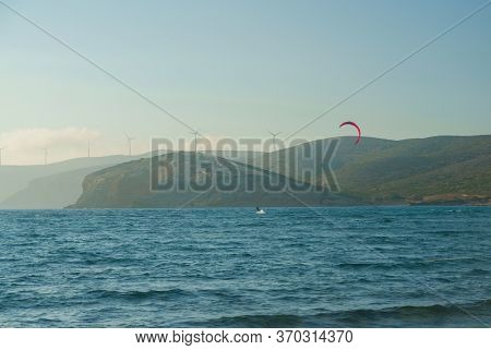 Kitesurfer Riding On The Waves At Prasonisi Kite Beach At Rhodes Island In Summer Day