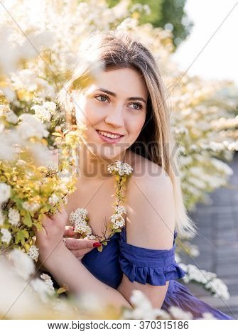 Sensual Calm Portrait Of Beautiful Hipster Woman In Blooming Bush With White Flowers Of Spirea. Copy