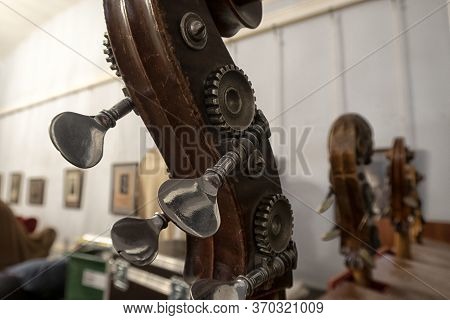 Contrabass On Stage In Front Of An Empty Hall