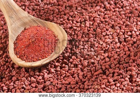 Achiote Seeds And Powder In The Spoon - Bixa Orellana