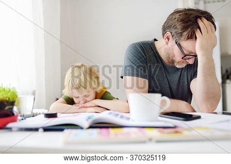 Tired And Angry Father Trying Help His Son Doing Homework, But Bored Child Refusing. Homeschooling, 