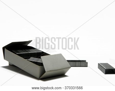 Insulated Metal Stapler Clips On White Background