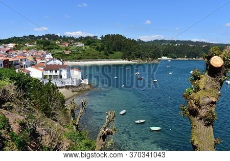 Small Fishing Village With Boats And Beach. Redes, Galicia, Spain.