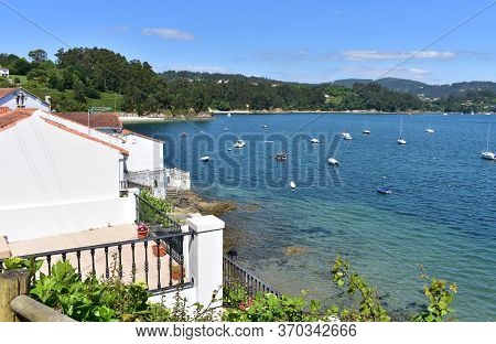 Small Fishing Village With Boats And Beach. Redes, Galicia, Spain.