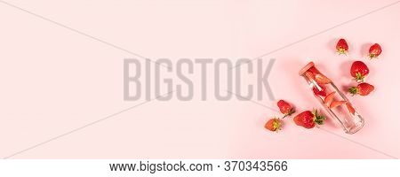 Bottle Of Detox Water , Cocktail, Lemonade Or Tea With Fresh Strawberry Summer Fruit On Pnk Backgrou