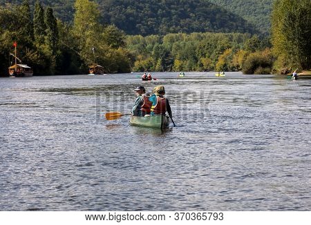 La Roque-gageac, Dordogne, France - September 3, 2018: Canoeing And Tourist Boat, In French Called G