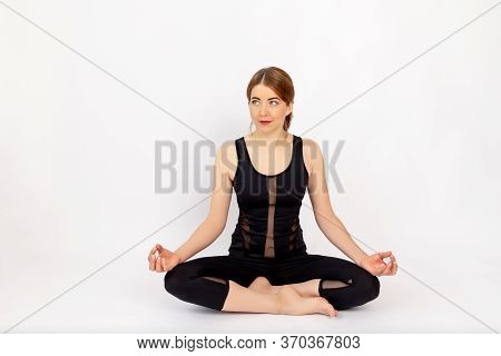 Beautiful Girl In Sports Uniform Doing Sports, On A White Background, Space For Tex