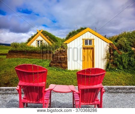 The picturesque village of old houses covered with turf and grass. Glaumbaer, Iceland. The concept of the ethnographic and historical tourism
