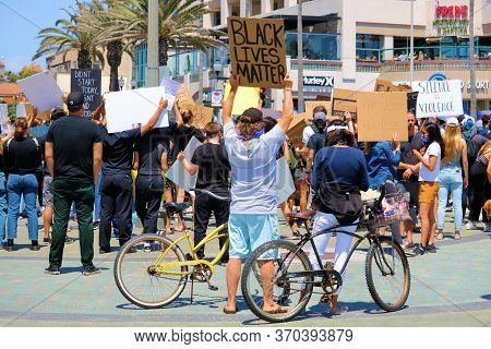 June 7, 2020 In Huntington Beach, Ca:  People Protesting For The Black Lives Matter Movement And Cri