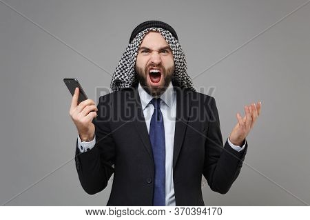 Irritated Bearded Arabian Muslim Businessman In Keffiyeh Kafiya Ring Igal Agal Classic Black Suit Is