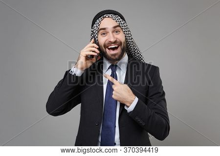 Excited Bearded Arabian Muslim Businessman In Keffiyeh Kafiya Ring Igal Agal Black Suit Isolated On 