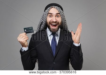 Excited Bearded Arabian Muslim Businessman In Keffiyeh Kafiya Ring Igal Agal Classic Black Suit Shir