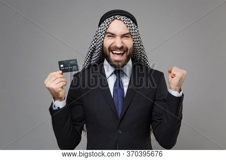 Joyful Arabian Muslim Businessman In Keffiyeh Kafiya Ring Igal Agal Classic Suit Isolated On Gray Ba