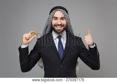 Smiling Arabian Muslim Businessman In Keffiyeh Kafiya Ring Igal Agal Black Suit Isolated On Gray Bac