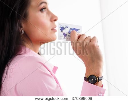 Close-up Of Young Attractive Female Holding Plastic Credit Card. Businesswoman In Presentable Suit W