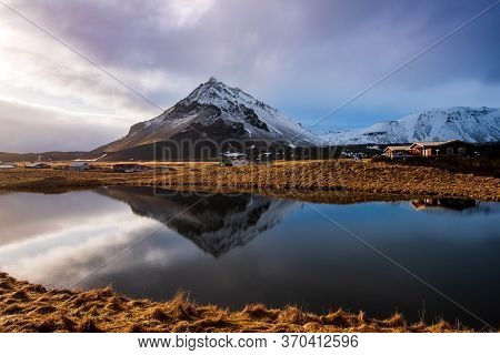 Icelandic Dramatic Landscape With Lake And Stapafell Mountains Covered In Snow At Snaefellsnes Penin