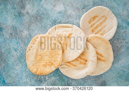 pita bread on the ble background