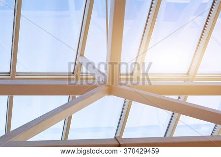 Steel Frame Of The Glazed Roof Of A Warehouse, Shopping Or Office Center. The Ceilings Are Made Of M