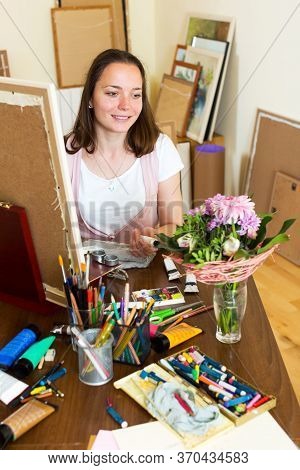 Positive Young Artist Paints A Picture At Home