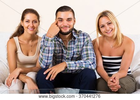 Portrait Of Two Charming Girls With Young Boyfriend