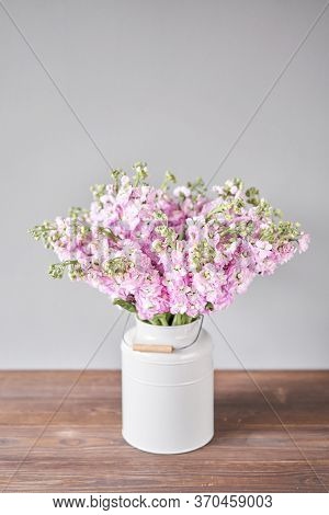 Bouquet Of Beautiful Lilac Mattiola. Spring Flowers In Vase On Wooden Table. Flowers Delivery.