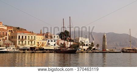 Symi, Greece - June 05, 2020: Symi Town, Symi Island, Pictorial View Of Colorful Houses And The Harb