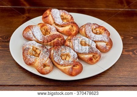 A Plate Of Food On A Wooden Table