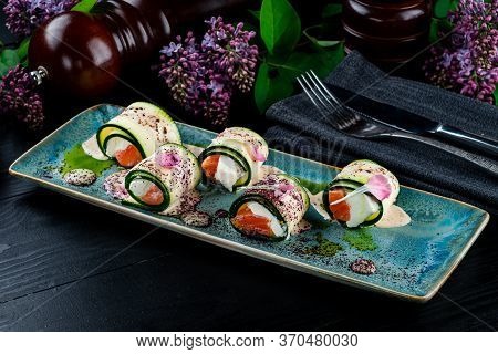 Cucumber Rounds With Smoked Salmon, Sushi Rolls With Salmon And Cream Cheese Wrapped In A Cucumber S