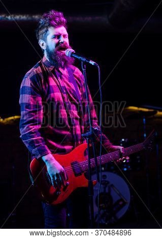 Frontman Concept. Man With Shouting Face Holds Guitar, Singing