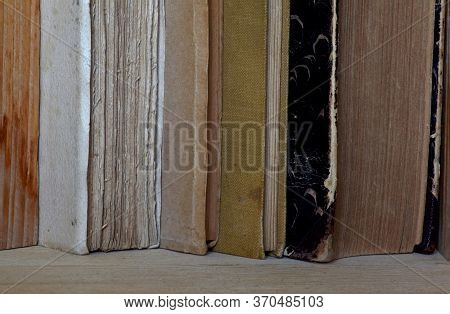 Old Book Standing Lined Up One Next To The Other