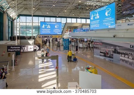 Rome, Italy - june 3, 2020: Departure terminal 3 in Rome Fiumicino Airport at the first day after Covid 19 pandemic lockdown in Italy. New pandemic rules on information boards