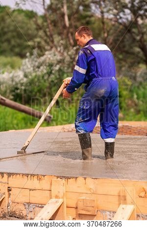 Leveling Of The Cement Or Concrete Of The Foundation Formwork From Concrete Mixer