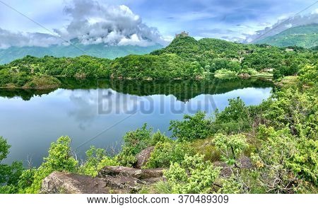 Italian lake and middle age castle. Lago Sirio, Piemonte, Italy.
