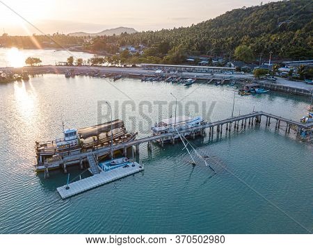 Aerial View Of Baan Tai Pier Or Huatean Pier At Phangan Island With Clear Blue Sky, Thailand